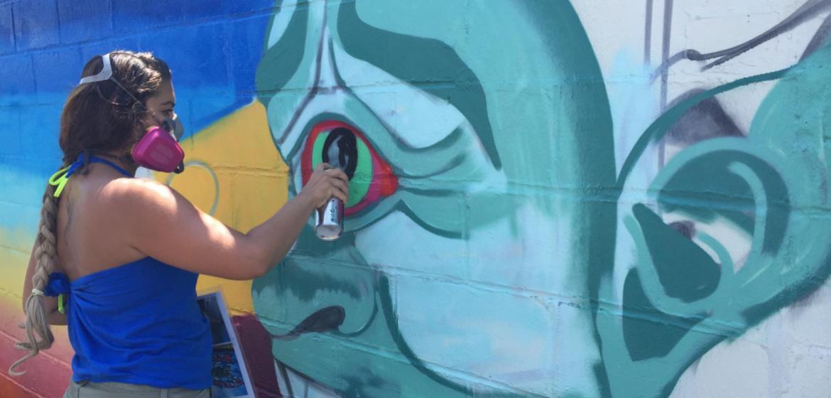 Meet the Artist! Brooklyn muralist Danielle Mastrion at work on a new wall in Deno's Wonder Wheel Park