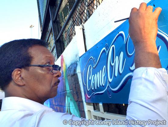 Sam Moses lettering a mural at Deno's Wonder Wheel Park, July 2017. Photo © Charles Denson