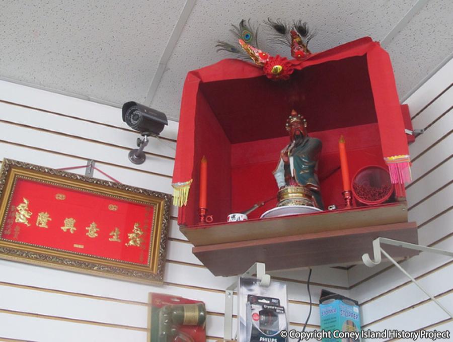 Shrine to General Guan Yu inside the pharmacy protects the business, 2015. Coney Island History Project Collection.